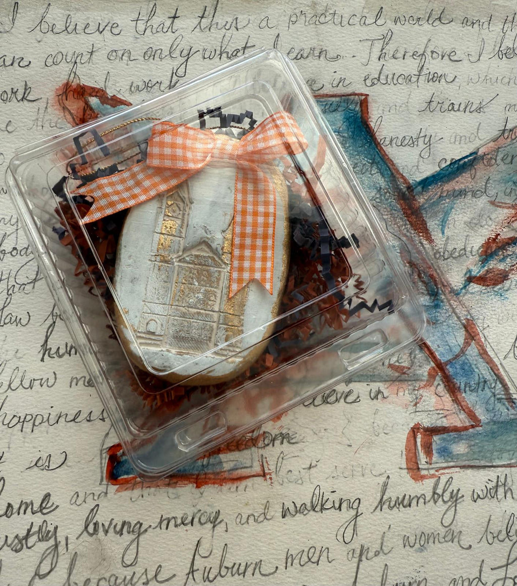 Hand-stamped clay intaglio ornament of Samford Hall with ribbon